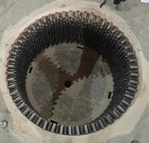 Cone crusher mould with alloy bars placed around the lining