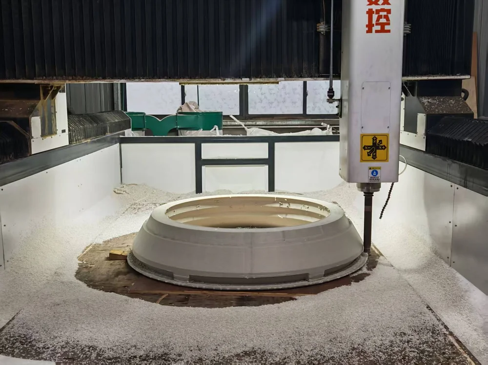 CNC machine cutting a large bowl liner mould from a printed blank