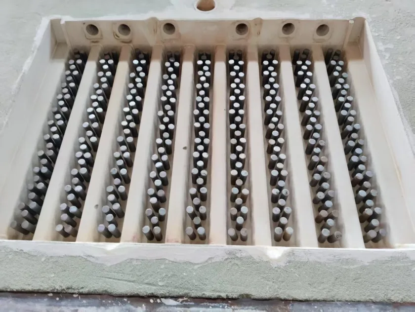 Alloy bars positioned in the mould before pouring