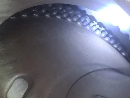 TiC insert casting after service - uneven worn face