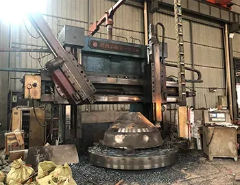 Vertical lathe machining a large bowl liner